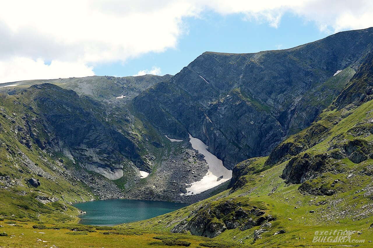 Panorama of the Rila mountain range with a lake